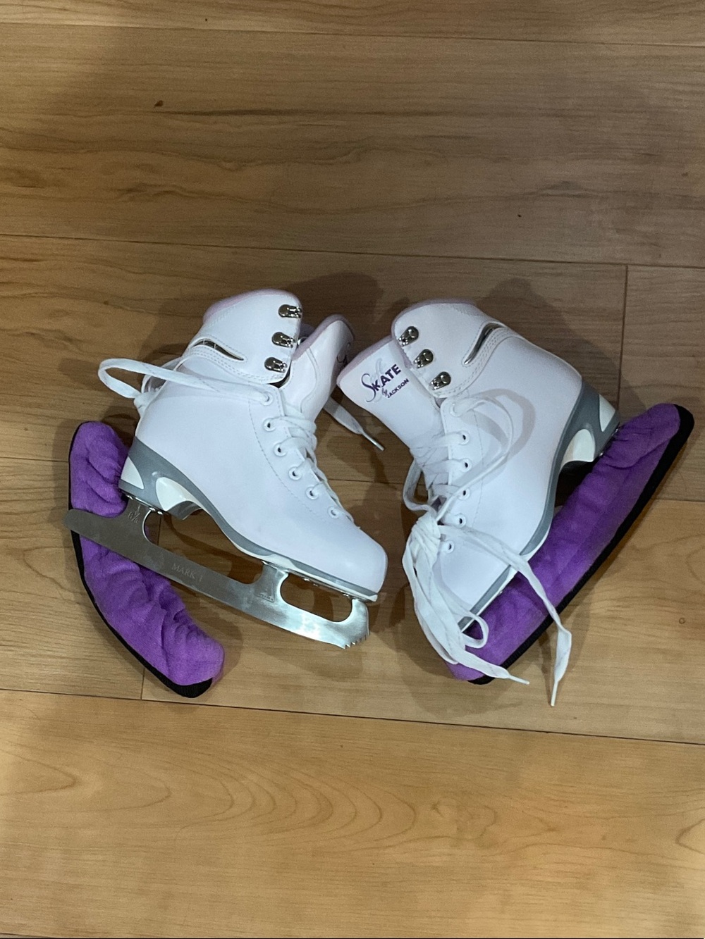 White Figure Ice Skates with Purple Blade Covers